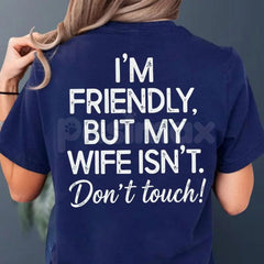 "I'm Friendly But My Wife Isn't" Funny Warning T-Shirt - Sarcastic Marriage Humor Graphic Tee, Premium 100% Cotton Husband Top, Hilarious Warning Label Style Shirt, Unique Anniversary or Father's Day Gift, Soft Lived-In Casual Apparel